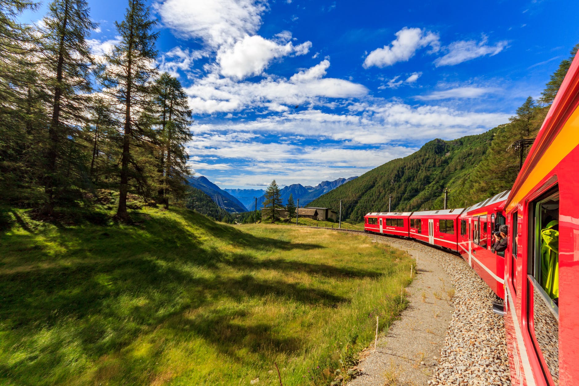 train in green mountains landscape
