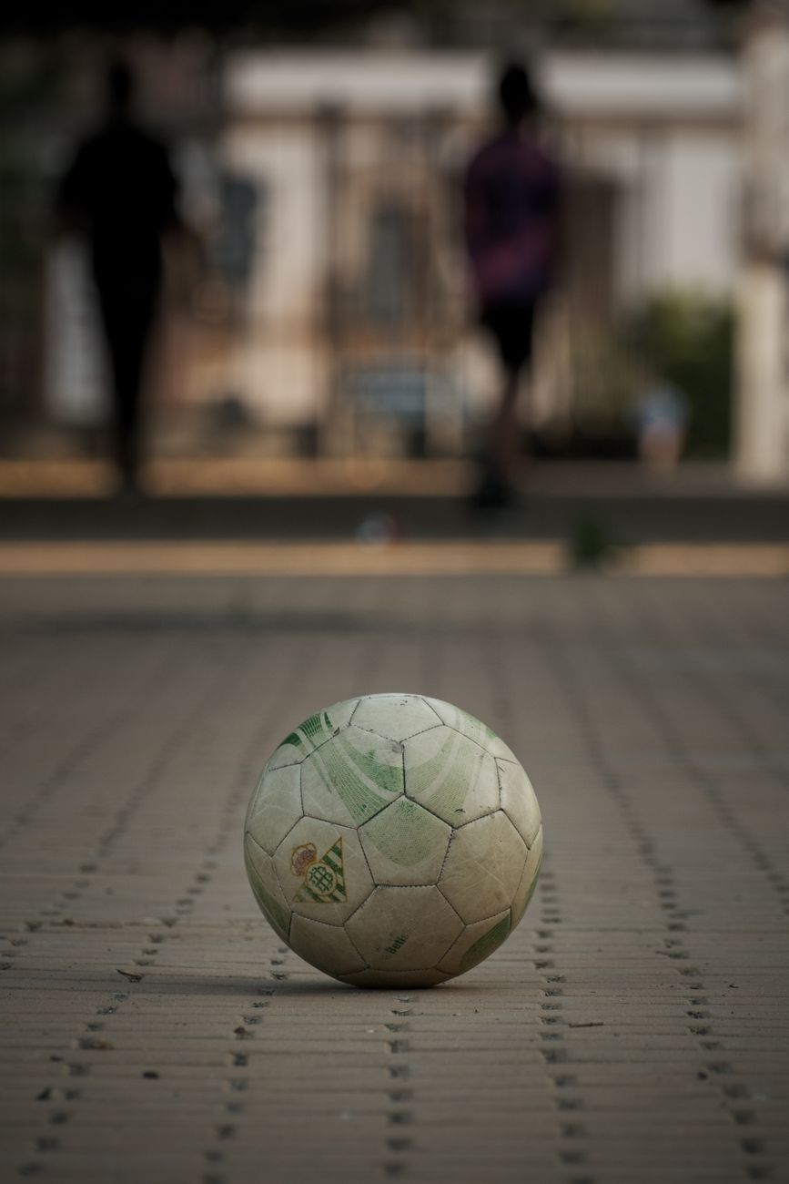 lonely soccer ball on urban street